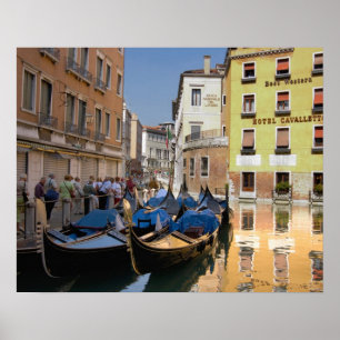 Italy, Venice, gondolas moored along canal Poster