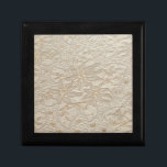 Ivory Chantilly Lace Gift Box<br><div class="desc">Prized by kings and queens Chantilly lace on a bridal gown or veil signifies timely elegance. Chantilly lace is a bobbin lace, hand-made in the region of Chantilly, France and Belgium. It was made popular during the 18th century when the black version was used for mourning shawls and veils in...</div>
