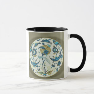 Iznik dish painted with a peacock perched among fl mug