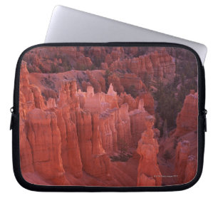 Jagged rock formations in desert laptop sleeve