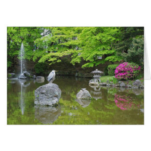 Japan, Kyoto. Heron in fresh green leaves