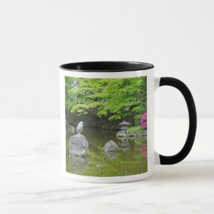 Japan, Kyoto. Heron in fresh green leaves Mug