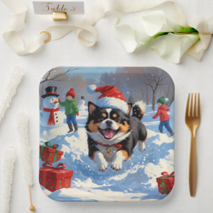 Japanese Chin Running in Snow with Christmas Hat Paper Plate