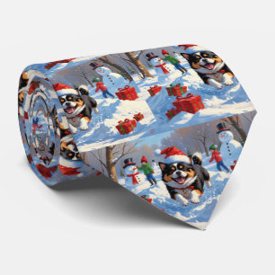 Japanese Chin Running in Snow with Christmas Hat Tie