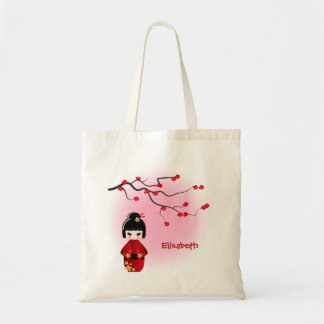 Japanese kokeshi doll at sakura blossoms tote bag