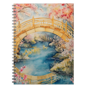 Japanese-style arched bridge spans a tranquil rive notebook