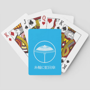 Japanese umbrella in a threadlike ring playing cards