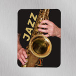Jazzman Playing Gold Saxophone Magnet<br><div class="desc">For jazz music fans! 3 x 4 inch,  flexible,  decorative magnet for home or office that features a photo image of a jazzman playing his time-worn,  gold coloured,  tenor saxophone horn with the word,  "JAZZ" printed in gold coloured block letters.</div>