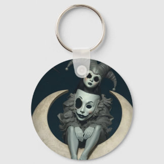 Jester sits on crescent moon wireless charger key ring