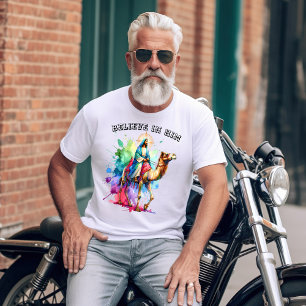 Jesus riding a camel through a vibrant landscape T-Shirt