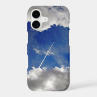 Jet plane trails between clouds