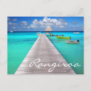 Jetty with boats in a tropical lagoon postcard