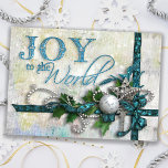 Jewelled Teal and Silver Holiday Card<br><div class="desc">Richly layered design in deep teal and silver featuring satin ribbons,  beads,  a silver filigree star,  diamond key,  silver ornament and holly. Text is embossed with a touch of glitter. Background is textured and distressed with twinkle highlights. Inside text is customisable. Matching products available.</div>