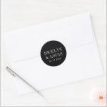 Jocelyn Black Modern Wedding Classic Round Sticker<br><div class="desc">Modern wedding stickers featuring a minimalist black design with your names in a large font along with your wedding date.  This design is simple enough for a formal wedding yet makes a bold statement.</div>