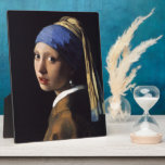Johannes Vermeer's Girl with a Pearl Earring Plaque<br><div class="desc">c. 1665. Johannes,  Jan or Johan Vermeer (1632 – December 1675) was a Dutch painter who specialised in domestic interior scenes of middle-class life.</div>
