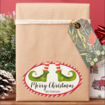 Jolly Christmas Elf Legs Stripes Holiday OVAL Oval Sticker<br><div class="desc">Fun elf legs wearing red and ivory striped tights and green boots with jingle bells, and your holiday Christmas details in chic lettering, these OVAL stickers are beautiful for party favours, gifts, invitation envelopes, homemade food gifts and more. ***ALL SHAPES are already done for you in our store plus see...</div>