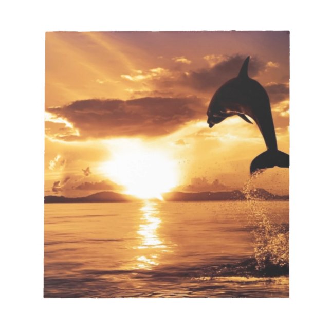 jumping dolphin with beautiful sunset over the sea notepad (Front)