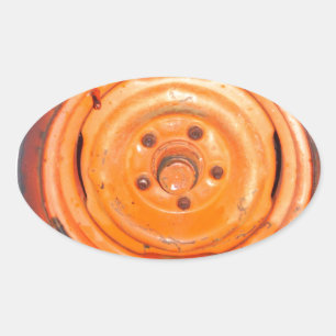 Junk Yard vintage Wheel, orange black and white Oval Sticker