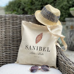 Junonia Seashell Destination Wedding Welcome Tote Bag<br><div class="desc">Welcome guests to your destination wedding with these chic beachy personalised tote bags. Design features a watercolor junonia seashell illustration with your wedding destination beneath (shown with Sanibel) in classic serif lettering. Add your names beneath in handwritten cursive script, as well as the year. Text colours can be changed to...</div>