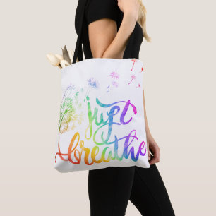 Just breathe    dandelion blowing in the wind  tote bag