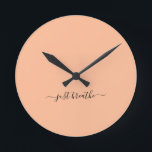 Just breathe orange elegant script yoga  round clock<br><div class="desc">Modern yoga clock with a chic orange (peach fuzz) background and an elegant hand lettered black script with the quote "just breathe".</div>