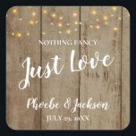 Just Love Rustic Country Glam Wedding Square Sticker<br><div class="desc">This rustic "Nothing fancy just love" square sticker will be the perfect way to decorate favours or seal envelopes! This design features a faux wood background,  darling string lights,  and white text in handwriting and block fonts.</div>