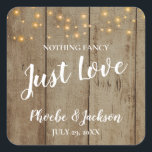 Just Love Rustic Country Glam Wedding Square Sticker<br><div class="desc">This rustic "Nothing fancy just love" square sticker will be the perfect way to decorate favours or seal envelopes! This design features a faux wood background,  darling string lights,  and white text in handwriting and block fonts.</div>