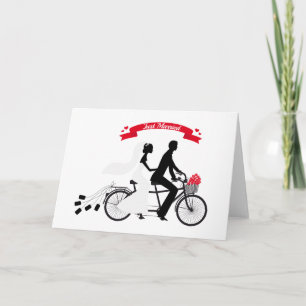 Just married bride and groom on tandem bicycle announcement