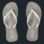 Just Married written in the Beach Sand Flip Flops<br><div class="desc">These fun just married flip flops feature the words "Just Married" written in the sand in white.  You can change the strap colour too!  Copyright Kathy Henis</div>