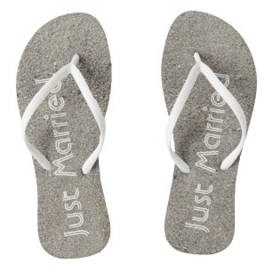 Just Married written in the Beach Sand Flip Flops