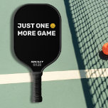 Just One More Game Custom Text Funny Pickleball Paddle<br><div class="desc">We all say it - just one more game - and then we play 5 more ;-) This funny pickleball paddle reads "JUST ONE MORE GAME" in a bold white text that's set against a black background and highlighted by a yellow pickleball (you can easily change the background colour). Add...</div>