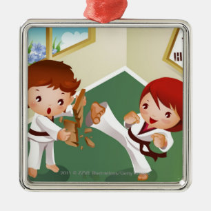Karate boy holding wood with another breaking it metal tree decoration