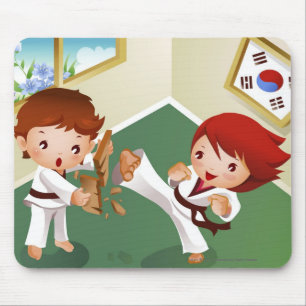Karate boy holding wood with another breaking it mouse mat