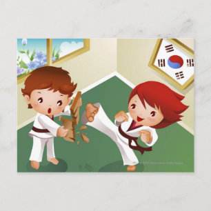 Karate boy holding wood with another breaking it postcard