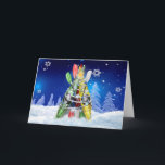 Kayak Christmas Tree Holiday Card<br><div class="desc">Whimsical kayaking greeting card with festive kayaks and paddles propped up,  decorated and wrapped in garland against a blue snowy star-filled nighttime sky for the Christmas season.  All rights reserved © katz_d_zynes</div>