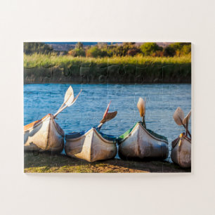 Kayaks by the river jigsaw puzzle