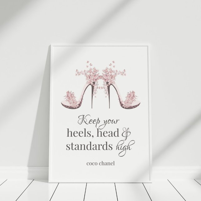 "Keep Your Heals, Head and Standards High" Poster ("Keep Your Heals, Head and Standards High" Poster in white frame against white wall.)