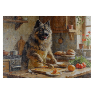 Keeshond Cooking in Kitchen Cutting Board