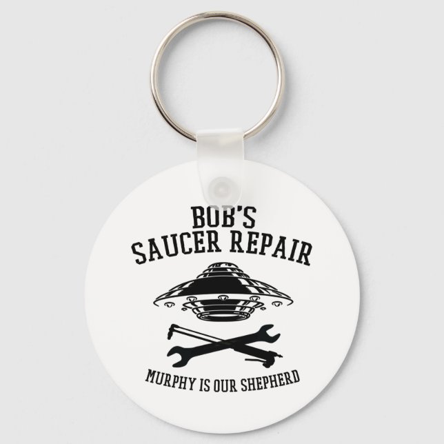keychain with black Bob's Saucer Repair logo  (Front)