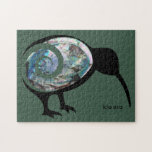 KIA ORA NZ KIWI BLACK PAUA FERN KORU NEW ZEALAND JIGSAW PUZZLE<br><div class="desc">New Zealand kiwi bird in black adorned with a sparkly, shiny, blue, green pāua shell colour body overlaid with a curved green fern koru. There is custom text at the base of this NZ design if you want to add a name, message, kia ora, or other personalised text. The Kiwi...</div>