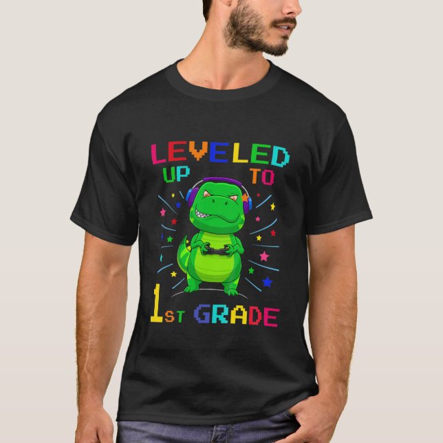 Kids Levelled Up To 1St Grade Gamer Dinosaur Back  T-Shirt (Front)