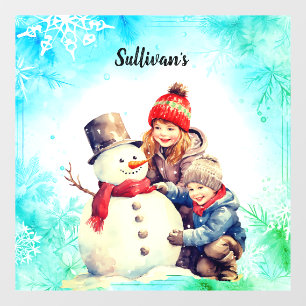 kids making a snowman window cling