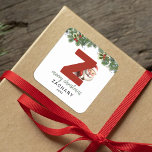 Kids Monogram Christmas Square Sticker<br><div class="desc">Give the gift of personalised charm this Christmas! Our monogram stickers,  featuring Santa hiding behind the letter Z,  are a unique and thoughtful way to show your love. Customise with a name,  year and a heartfelt greeting. Make your Christmas gifts stand out!</div>