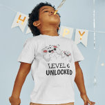 Kids Video Gaming T-Shirt<br><div class="desc">These cool gamer tshirts featuring two gaming control pads over a white background,  with playful text that reads "LEVEL 6 UNLOCKED" and "THEIR NAME AND AGE". All font styles and colours can be changed by clicking on the customise further link after personalising.</div>