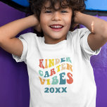 Kindergarten vibes back to school retro  T-Shirt<br><div class="desc">Get your little one ready for a back-to-school in style with this "Kindergarten Vibes" t-shirt! This retro-inspired design is bursting with cool colours and vintage flair and it's perfect for your trendy kiddo who's ready to rock their pre-K days. Customise it with the current year to create a unique keepsake...</div>