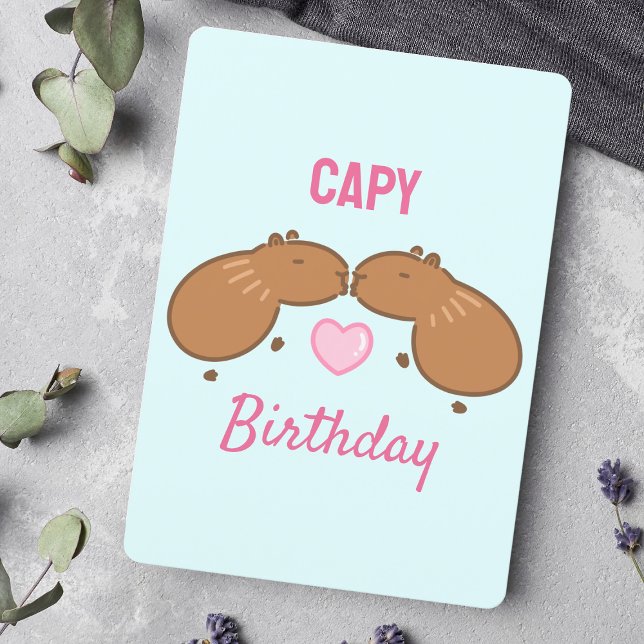 Kissing Capybara Couple Birthday Card (Wishing a happy birthday with animal pun art featuring two kissing capybaras and love.)