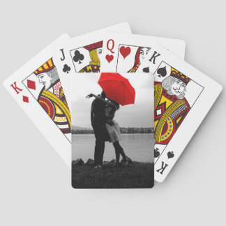 Kissing under an umbrella playing cards