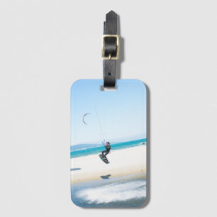 Kitesurfer boosts an air luggage tag