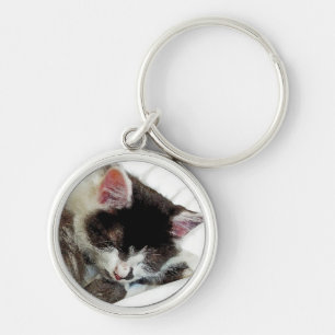 Kitten asleep on White Comforter Key Ring