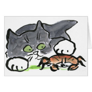 Kitten has found a Crab on the Beach